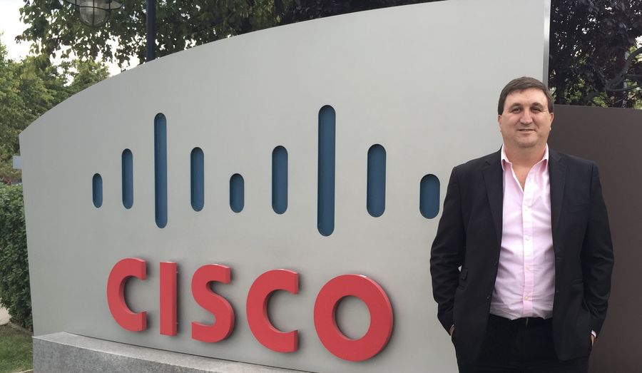 Mariano standing next to the Cisco sign at a Cisco campus